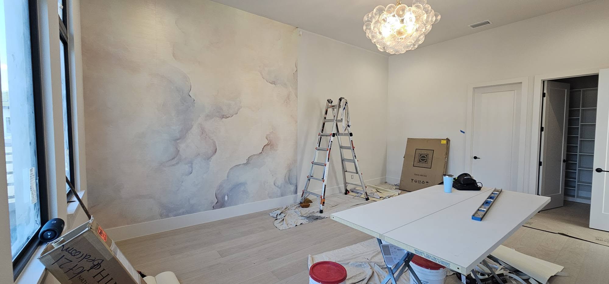 Soft abstract wallcovering installed in a bright residential room