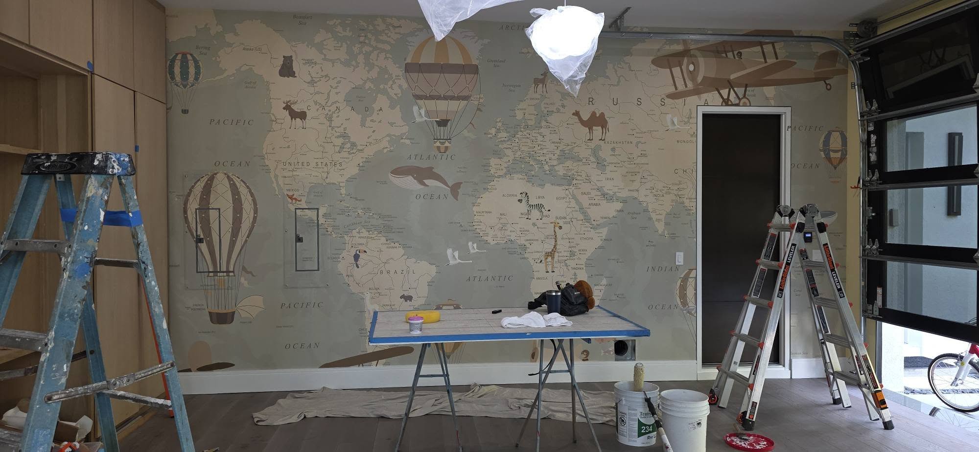 World map wall mural installed in a residential room
